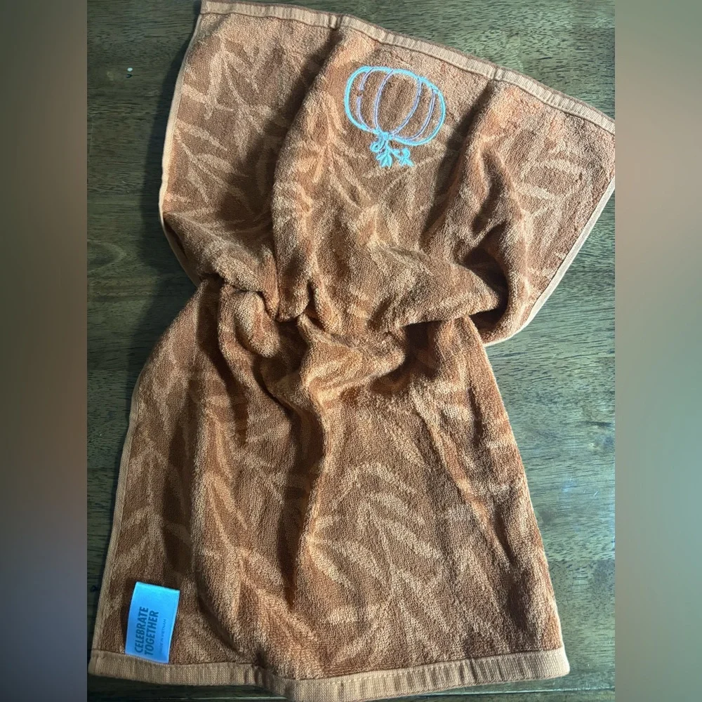 Hand crocheted orange fall towel with embroidered pumpkin